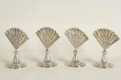 Lot 360 - A CASED SET OF FOUR LATE VICTORIAN NOVELTY SILVER MENU HOLDERS MODELLED AS FANS