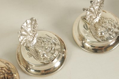 Lot 434 - A CASED SET OF SIX SILVER OYSTER SHELL AND PEARL MENU HOLDERS