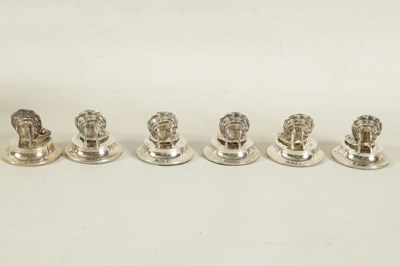 Lot 434 - A CASED SET OF SIX SILVER OYSTER SHELL AND PEARL MENU HOLDERS