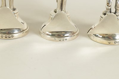 Lot 448 - A CASED SET OF SIX MILITARY FIGURE CAST SILVER MENU HOLDERS