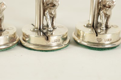 Lot 327 - A CASED SET OF FOUR SILVER ELEPHANT AND PALM TREE MENU HOLDERS