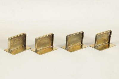 Lot 479 - A CASED SET OF FOUR SILVER GILT AND BLUE GUILLOCHE ENAMEL MENU HOLDERS