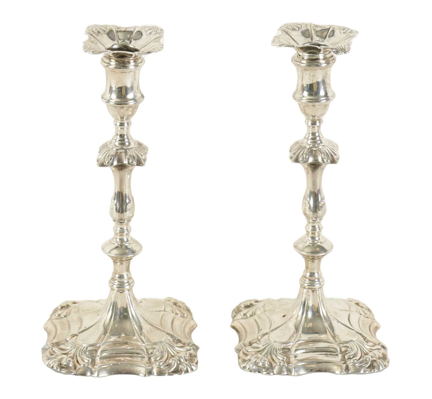 Lot 400 - A PAIR OF GEORGE III CAST SILVER 'ROCOCO' CANDLESTICKS