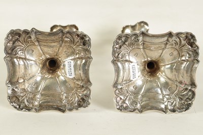 Lot 400 - A PAIR OF GEORGE III CAST SILVER 'ROCOCO' CANDLESTICKS