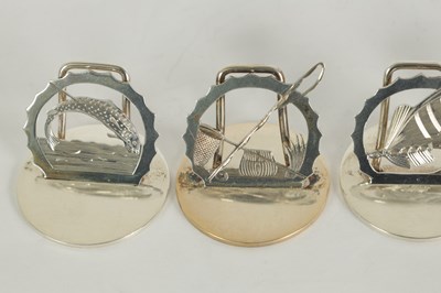 Lot 391 - A SET OF FOUR SILVER FLY FISHING MENU HOLDERS