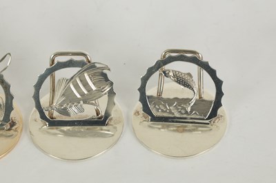 Lot 391 - A SET OF FOUR SILVER FLY FISHING MENU HOLDERS