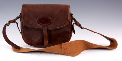 Lot 351 - A BROWN LEATHER CARTRIDGE BAG on leather and...