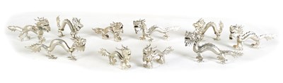 Lot 147 - A SET OF TEN LATE 19TH CENTURY CHINESE SILVER DRAGON MENU HOLDERS