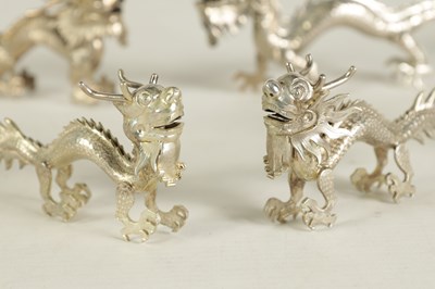 Lot 147 - A SET OF TEN LATE 19TH CENTURY CHINESE SILVER DRAGON MENU HOLDERS