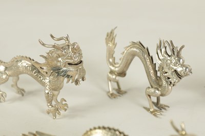 Lot 147 - A SET OF TEN LATE 19TH CENTURY CHINESE SILVER DRAGON MENU HOLDERS