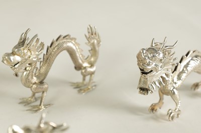 Lot 147 - A SET OF TEN LATE 19TH CENTURY CHINESE SILVER DRAGON MENU HOLDERS