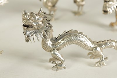 Lot 147 - A SET OF TEN LATE 19TH CENTURY CHINESE SILVER DRAGON MENU HOLDERS