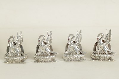 Lot 395 - A CASED SET OF FOUR SILVER HERALDIC MENU HOLDERS BY ASPREY