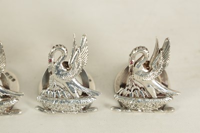 Lot 395 - A CASED SET OF FOUR SILVER HERALDIC MENU HOLDERS BY ASPREY