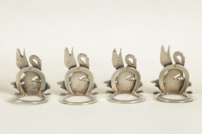Lot 395 - A CASED SET OF FOUR SILVER HERALDIC MENU HOLDERS BY ASPREY