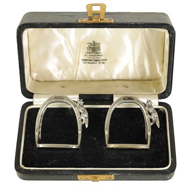 Lot 404 - A CASED PAIR OF SILVER STIRRUP AND FOX MENU HOLDERS