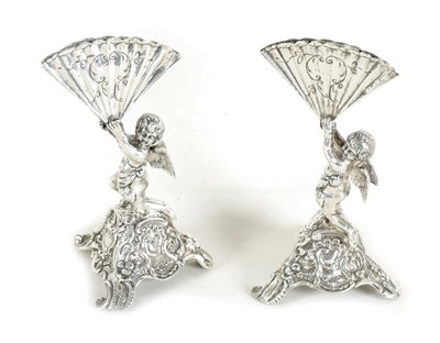 Lot 326 - A PAIR OF CONTINENTAL SILVER FIGURAL MENU HOLDERS