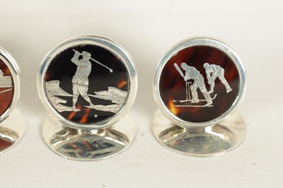 Lot 412 - A CASED SET OF FOUR SILVER AND TORTOISESHELL SPORTING SCENE MENU HOLDERS