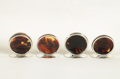 Lot 412 - A CASED SET OF FOUR SILVER AND TORTOISESHELL SPORTING SCENE MENU HOLDERS