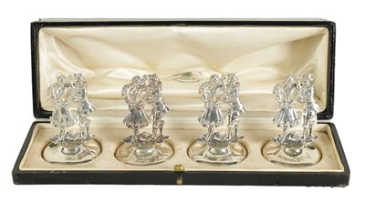 Lot 379 - A CASED SET OF FOUR SILVER FIGURAL MENU HOLDERS