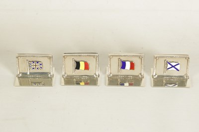 Lot 340 - A CASED SET OF FOUR SILVER AND ENAMEL FLAG MENU HOLDERS