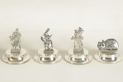 Lot 351 - A CASED SET OF FOUR SILVER 'ALICE IN WONDERLAND' MENU HOLDERS