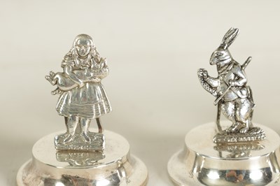 Lot 351 - A CASED SET OF FOUR SILVER 'ALICE IN WONDERLAND' MENU HOLDERS