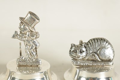 Lot 351 - A CASED SET OF FOUR SILVER 'ALICE IN WONDERLAND' MENU HOLDERS