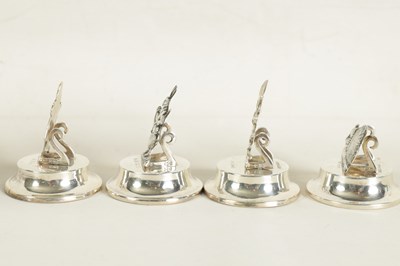 Lot 351 - A CASED SET OF FOUR SILVER 'ALICE IN WONDERLAND' MENU HOLDERS