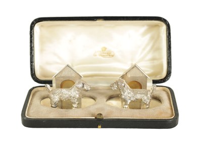 Lot 350 - A CASED PAIR OF CAST SILVER NORFOLK TERRIER MENU HOLDERS