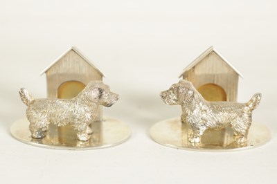 Lot 350 - A CASED PAIR OF CAST SILVER NORFOLK TERRIER MENU HOLDERS
