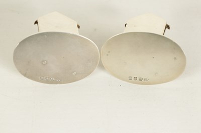 Lot 350 - A CASED PAIR OF CAST SILVER NORFOLK TERRIER MENU HOLDERS