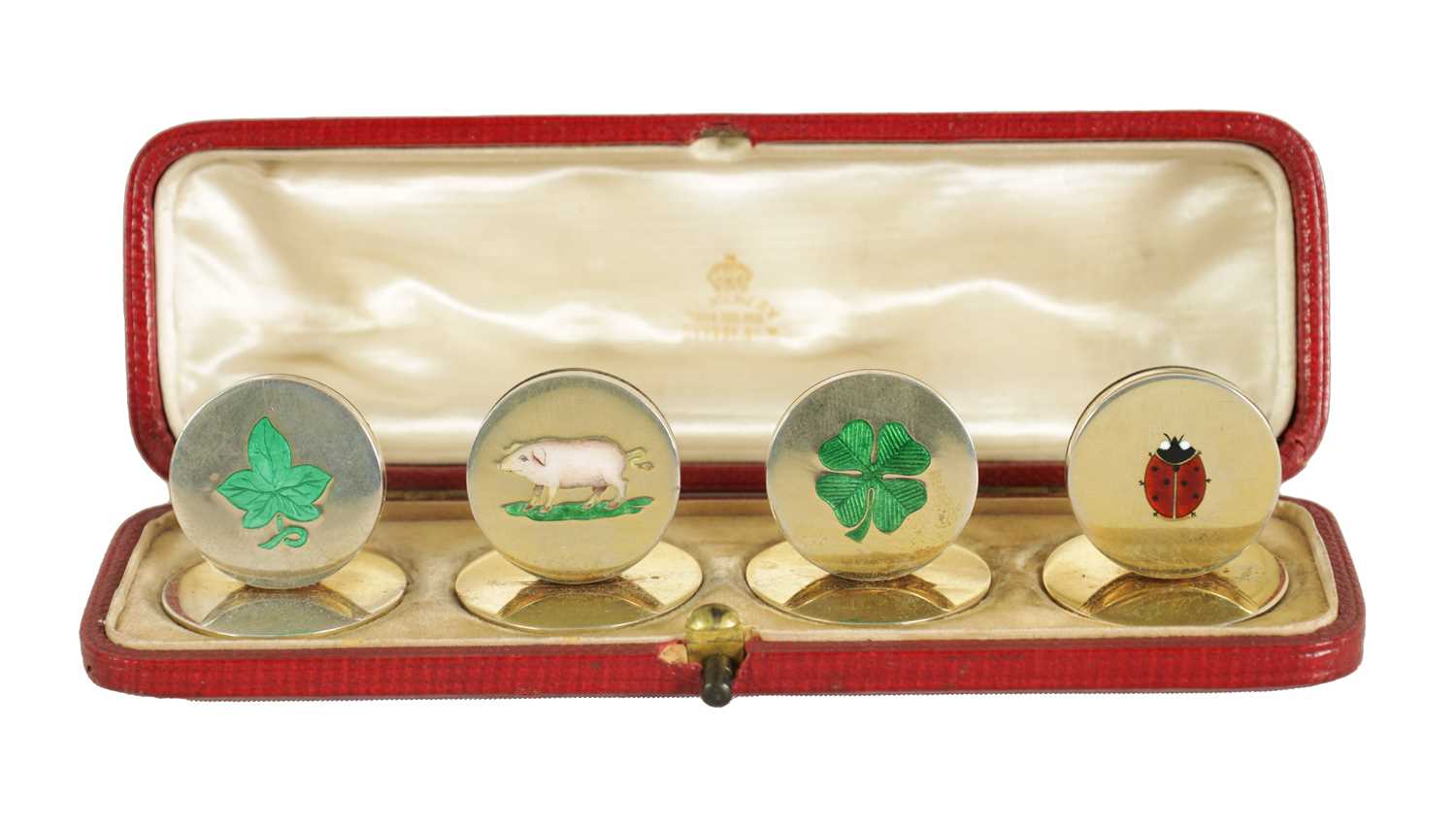 Lot 377 - A RARE SET OF SILVER GILT AND ENAMEL 'LUCKY' MOTIF MENU HOLDERS