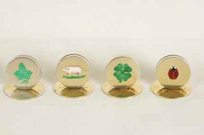 Lot 377 - A RARE SET OF SILVER GILT AND ENAMEL 'LUCKY' MOTIF MENU HOLDERS