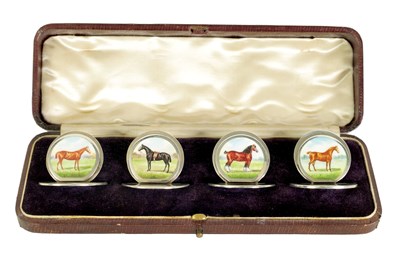 Lot 430 - A FINE CASED SET OF FOUR SILVER AND ENAMEL HORSE MENU HOLDERS