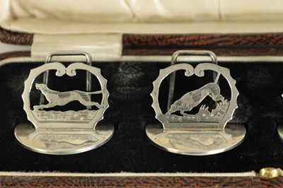 Lot 376 - A CASED SET OF FOUR SILVER FOX AND HOUNDS MENU HOLDERS