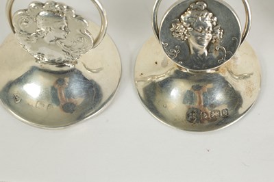 Lot 440 - A SET OF FOUR ART NOVEAU SILVER MENU HOLDERS