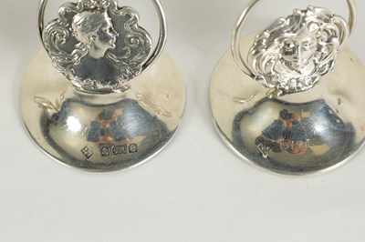 Lot 440 - A SET OF FOUR ART NOVEAU SILVER MENU HOLDERS