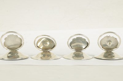 Lot 440 - A SET OF FOUR ART NOVEAU SILVER MENU HOLDERS