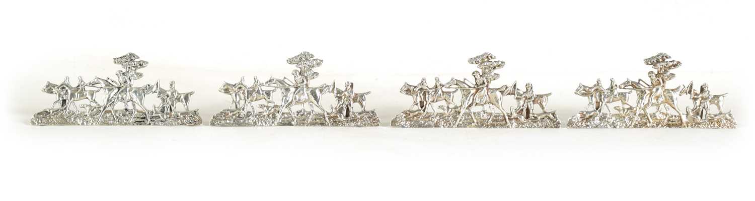 Lot 338 - A SET OF FOUR LARGE CAST SILVER HUNTING SCENE MENU HOLDERS