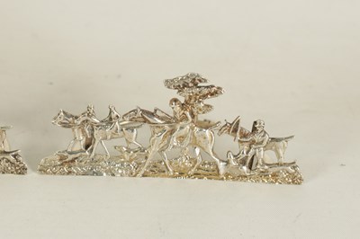 Lot 338 - A SET OF FOUR LARGE CAST SILVER HUNTING SCENE MENU HOLDERS