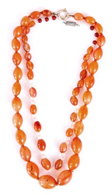 Lot 374 - TWO ORANGE AGATE NECKLACES of graduated form,...