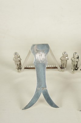 Lot 438 - A SET OF SEVEN SILVER FIGURAL MENU HOLDERS