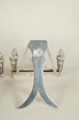 Lot 438 - A SET OF SEVEN SILVER FIGURAL MENU HOLDERS