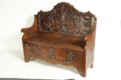 Lot 1037 - AN EARLY 20TH CENTURY CARVED LINDEN WOOD BLACK FOREST HALL BENCH