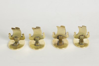 Lot 389 - A SET OF FOUR NORWEGIAN SILVER GILT AND ENAMEL VIKING SHIP MENU HOLDERS