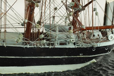 Lot 632 - A 19TH CENTURY MODEL OF A TRIPLE MASTED SHIP BEING TUGGED IN BY A STEAMBOAT