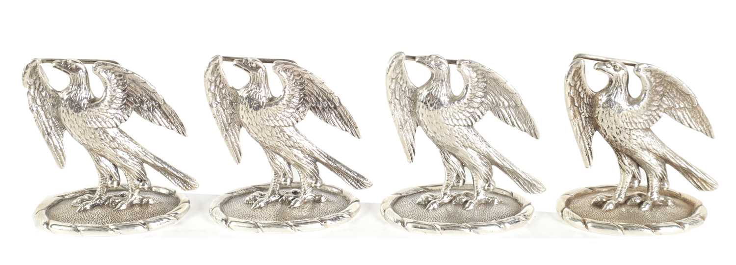 Lot 475 - A SET OF FOUR SILVER EAGLE MENU HOLDERS