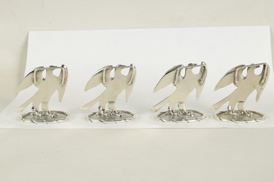 Lot 475 - A SET OF FOUR SILVER EAGLE MENU HOLDERS