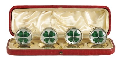 Lot 344 - A CASED SET OF FOUR SILVER AND MOTHER OF PEARL SHAMROCK MENU HOLDERS